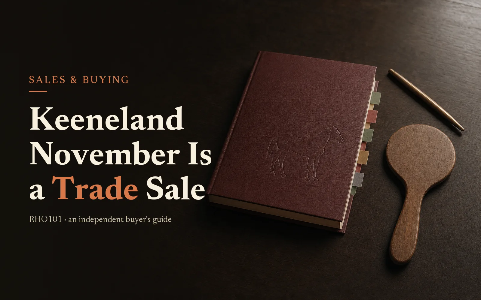 Oxblood sale catalogue and bidder's paddle on dark oak, headline: Keeneland November Is a Trade Sale