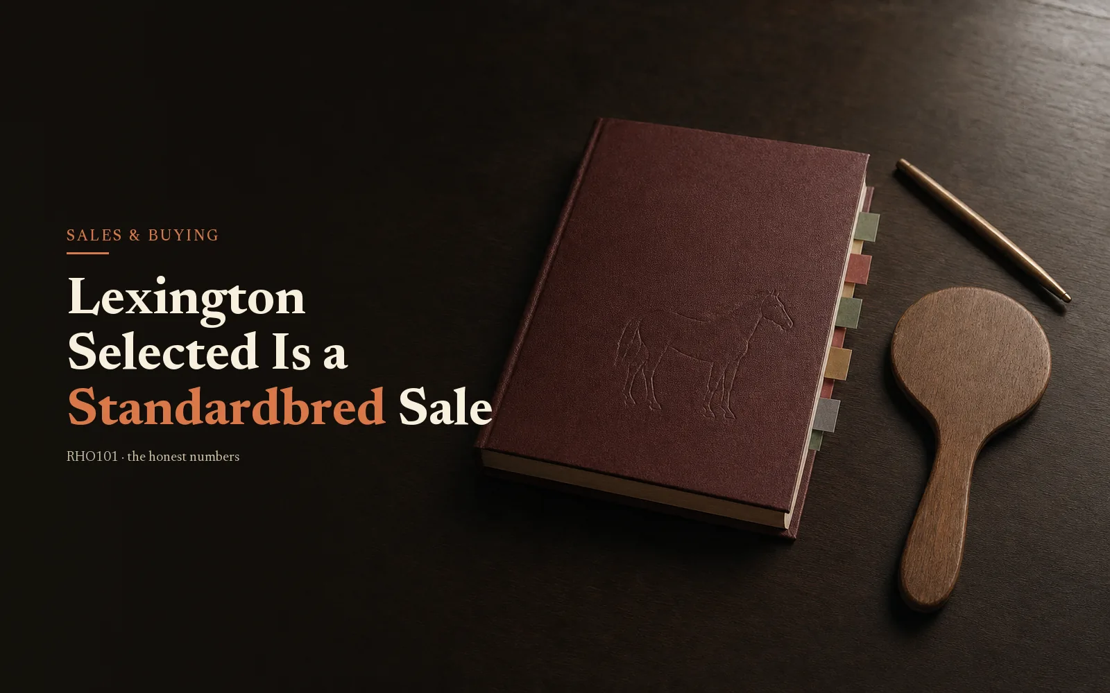 Oxblood yearling sale catalogue and bidder's paddle on dark oak, headline: Lexington Selected Is a Standardbred Sale